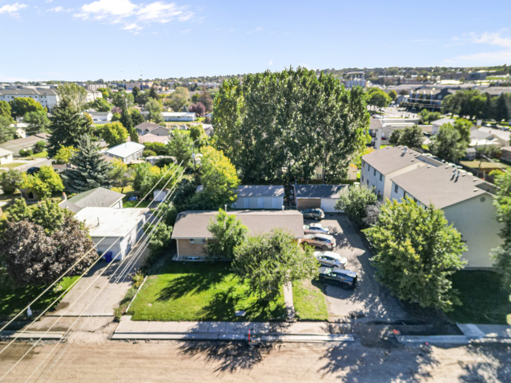 Aerial view of the fourplex, storage building and garage at 343 S 4th W, Rexburg, Idaho
