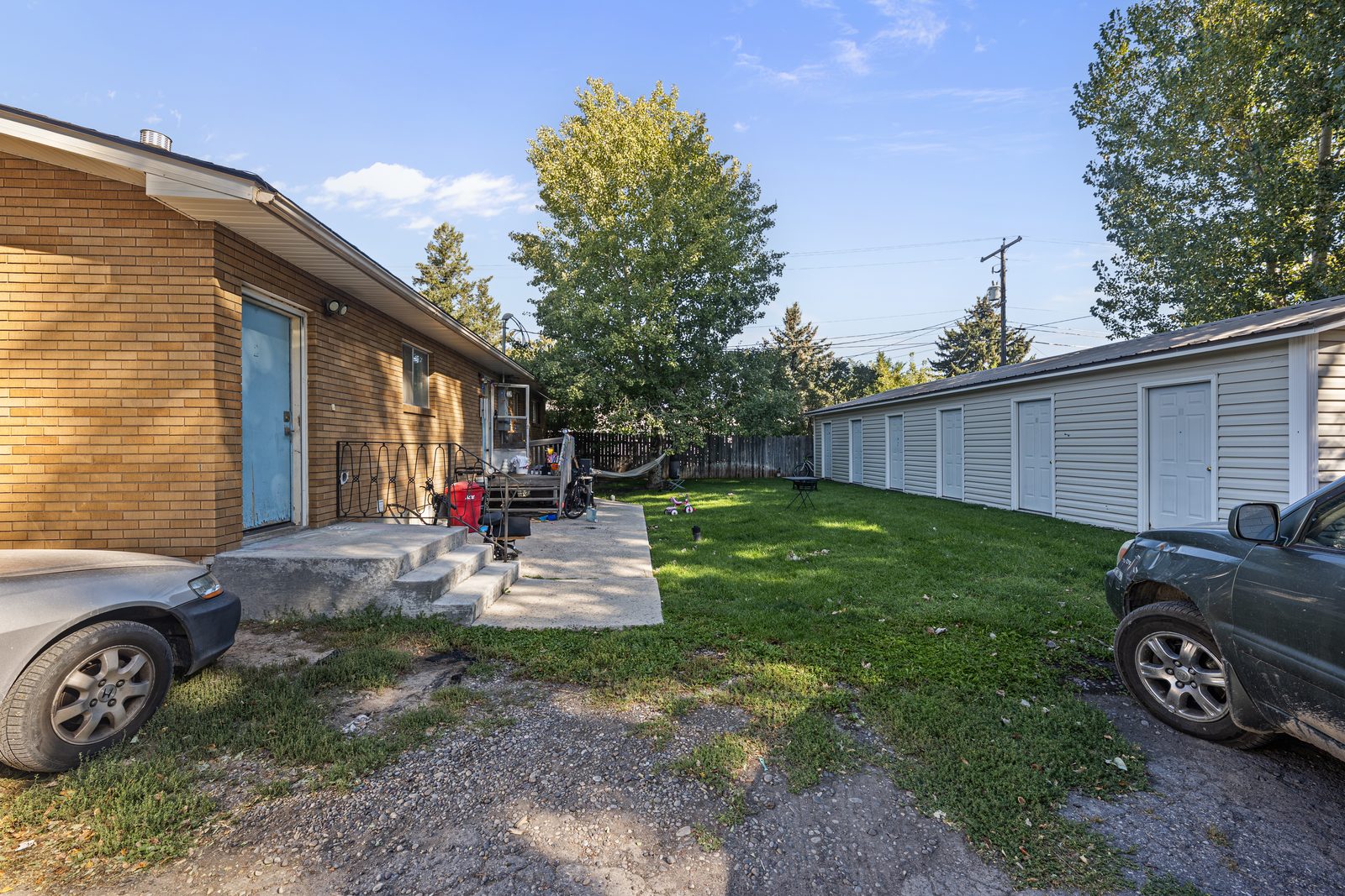 Side entry and patio with the storage building behind