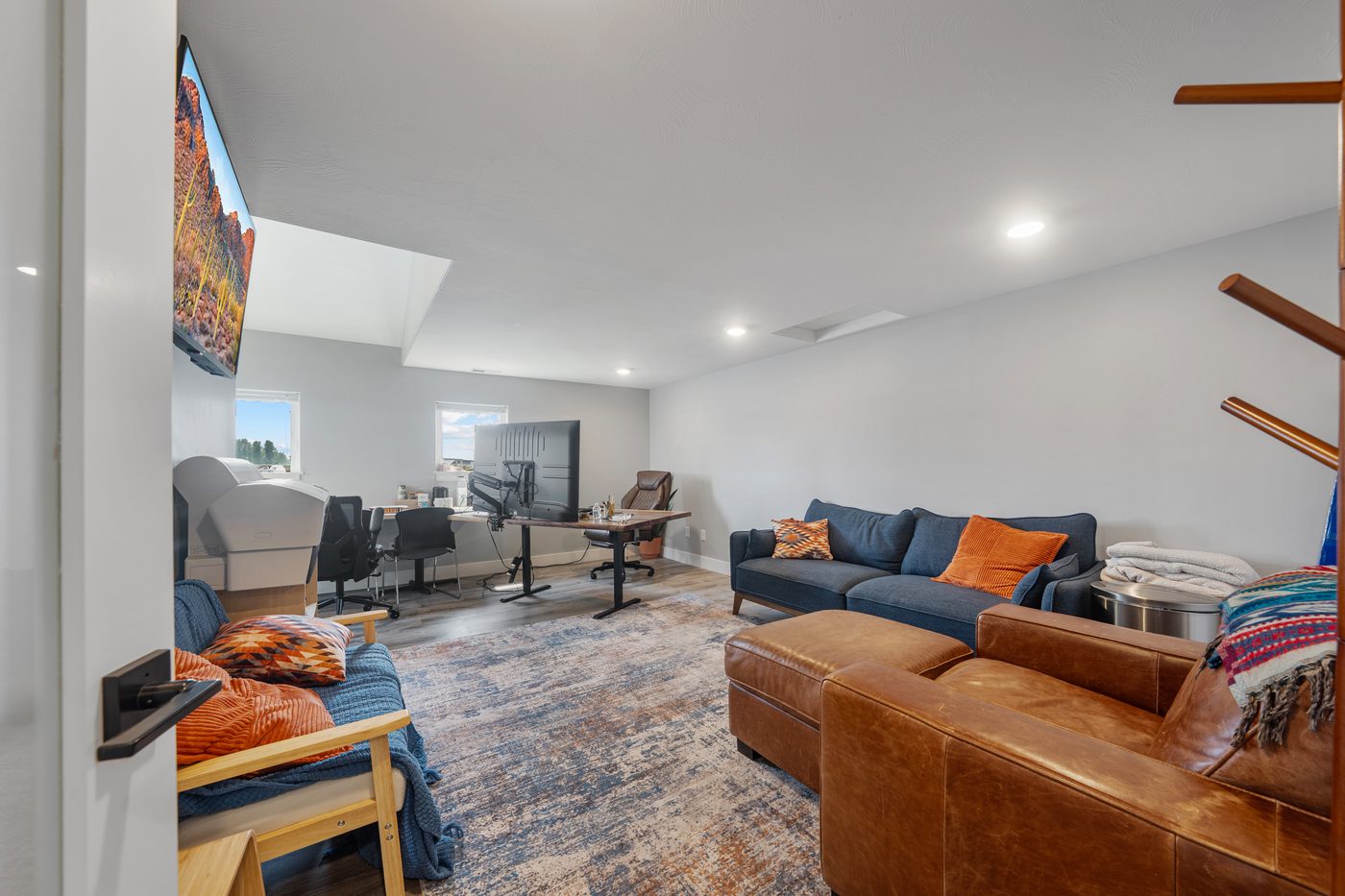 Lounge seating area with couches and TV